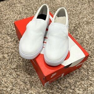 White Nike slip on shoes